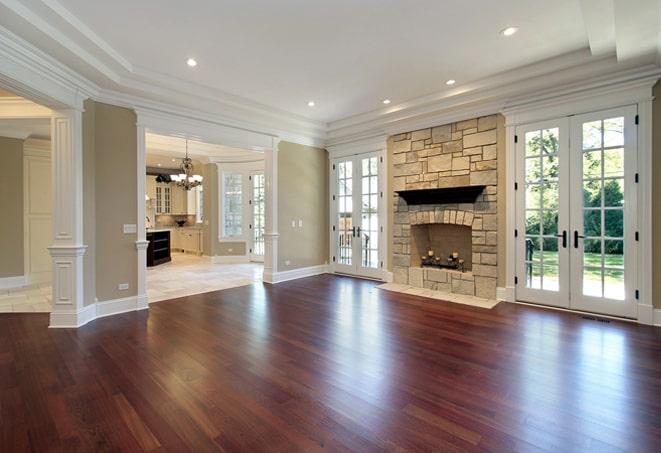 brightly lit room with shiny wood floor